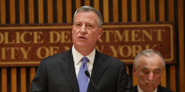 NEW YORK, NY - NOVEMBER 10: New York City Mayor Bill de Blasio (C) speaks at a news conference with New York City Police Commissioner Bill Bratton (R) to announce changes to New York City's marijuana policy on November 10, 2014 in New York City. The commissioner and New York City Mayor Bill de Blasio announced that the city will start giving out tickets, and court summons, rather than arresting people for possession of 25 grams of marijuana and under. The new guidelines for officers will result in hundreds of less arrests per year, freeing up the police to focus on other crimes. It will also free those caught with the drug from having a damaging arrest record. (Photo by Spencer Platt/Getty Images)