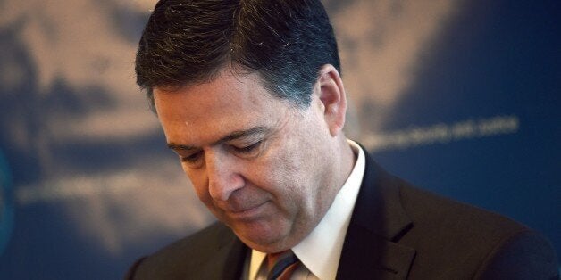 Federal Bureau of Investigation (FBI) director James Comey attends a conference on 'Todays Terrorism: Todays Counterterrorism' in New York on November 3, 2014. US faces an increasing number of homegrown violent extremists radicalized online and inspired by jihadists in Syria to carry out acts of violence, Comey warned during the conference. Comey said the danger was witnessed 'in a very real way' by attacks that killed two soldiers in Canada in recent weeks. In a speech in New York, Comey said tracking down those inspired by the so-called Islamic State group in Syria was 'extremely difficult and something we spend every single day working on.' AFP PHOTO/Jewel Samad (Photo credit should read JEWEL SAMAD/AFP/Getty Images)