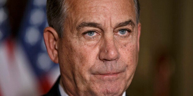 House Speaker John Boehner of Ohio responds to President Barack Obama's intention to spare millions of illegal immigrants from being deported, a use of executive powers that is setting up a fight with Republicans in Congress over the limits of presidential powers, Friday, Nov. 21, 2014, during a news conference on Capitol Hill in Washington. Boehner, who has refused to have his members vote on broad immigration legislation passed by the Senate last year, said earlier that Obama's decision to go it alone "cemented his legacy of lawlessness and squandered what little credibility he had left." (AP Photo/J. Scott Applewhite)