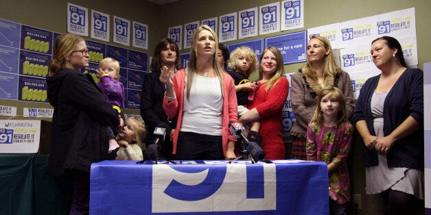 Mother and marijuana activist Leah Maurer speaks with reporters about legalization surrounded by other members of the Moms for YES on Measure 91 group, Friday, Oct. 17, 2014 in Portland, Ore. Leah says marijuana is now sold outside schools and under the bleachers at games, but legalizing it would lead to more regulations and would make it less available to children. (AP Photo/Gosia Wozniacka)