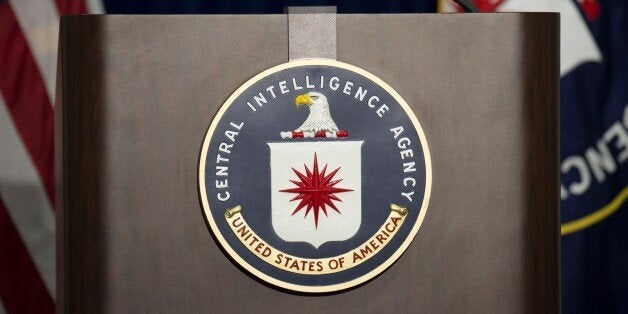 The lectern stands empty as reporters await the arrival of Director of Central Intelligence Agency John Brennan for a press c