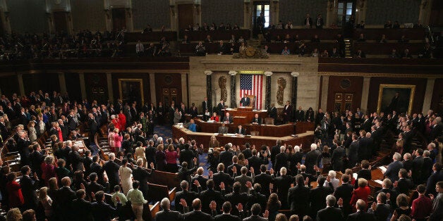 WASHINGTON, DC - JANUARY 06: Members of the 114th Congress raise their right hand as they are sworn in at the US Capitol January 6, 2015 in Washington, DC. Today Congress convened its first session of the 114th Congress with Republicans controlling both the House and Senate. (Photo by Mark Wilson/Getty Images)