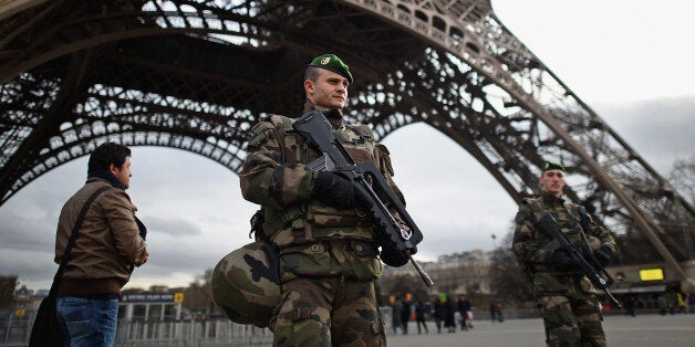 PARIS, FRANCE - JANUARY 12: French troops patrol around the Eifel Tower on January 12, 2015 in Paris, France. France is set to deploy 10,000 troops to boost security following last week's deadly attacks while also mobilizing thousands of police to patrol Jewish schools and synagogues. (Photo by Jeff J Mitchell/Getty Images)