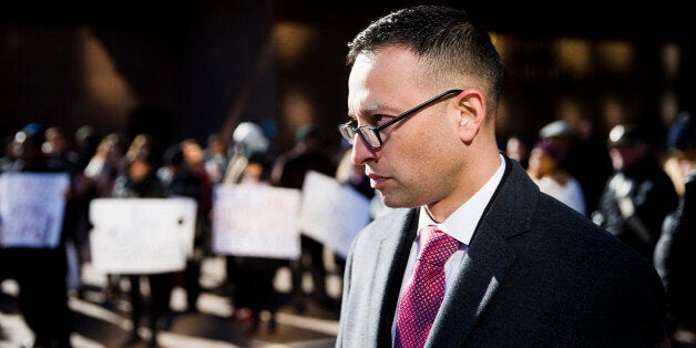 Syed Farhaj Hassan stands after he and other Muslim residents of New Jersey were in court to try to reverse a ruling that found New York City police could legally monitor their activities, Tuesday, Jan. 13, 2015, outside the U.S. Courthouse in Philadelphia. Two civil rights groups, Muslim Advocates and the Center for Constitutional Rights, argued their appeal Tuesday before the 3rd U.S. Circuit Court of Appeals in Philadelphia. The plaintiffs include a U.S. soldier, a school principal and several Rutgers University students. (AP Photo/Matt Rourke)