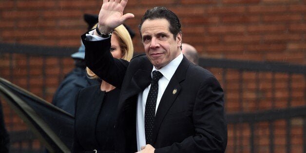 New York Governor Andrew Cuomo arrives at a funeral home to attend a wake for New York Police Department (NYPD) officer Wenji