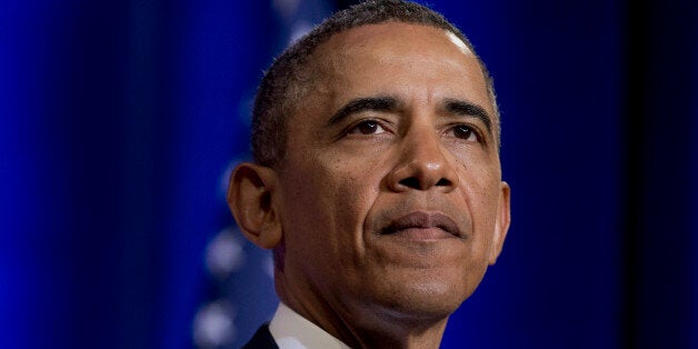 President Barack Obama pauses while talking about National Security Agency (NSA)surveillance, Friday, Jan. 17, 2014, at the J