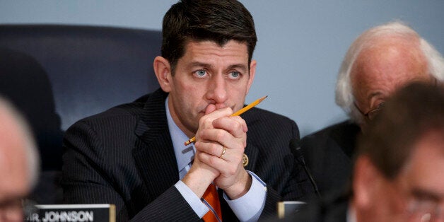 House Ways and Means Committee Chairman Paul Ryan, R-Wisc., listens as Treasury Secretary Jack Lew defends President Barack Obama's new budget proposals, on Capitol Hill in Washington, Tuesday, Feb. 3, 2015. Rep. Ryan, who agrees with Obama on extending the earned income tax credit to more workers without children, says he hopes that lawmakers and the administration could agree on ways to finance expanding the EITC. (AP Photo/J. Scott Applewhite)