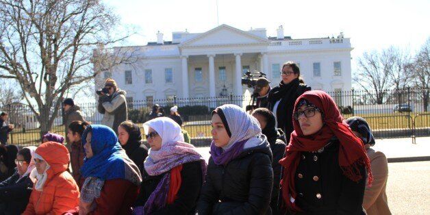 WASHINGTON D.C, UNITED STATES - FEBRUARY 13: A group of Muslims perform Friday Prayer, compulsory prayer for adult men on Islam's holy day Friday, in front of the White House to attract the world's attention for the Chapel Hill Shooting, as well as non-Muslims support them, on February 13, 2015. Three young Muslim Students, Deah Shaddy Barakat, his wife Yusor Mohammad, and her sister Razan Mohammad Abu-Salha were killed on 10th of February 2015 in Chapel Hill, North Carolina, United States at their home on 10th of February 2015. A 46-year-old man was charged with the murder of three Muslim students who were fatally shot Tuesday at the University of North Carolinas residential complex in Chapel Hill, police said Wednesday. (Photo by Bariskan Unal/Anadolu Agency/Getty Images)
