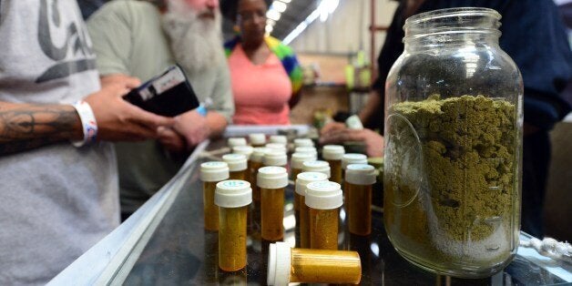 Card-carrying medical marijuana patients eager to learn more about Kief, in jar, at Los Angeles' first-ever cannabis farmer's market at the West Coast Collective medical marijuana dispensary, on the fourth of July, or Independence Day, in Los Angeles, California on July 4, 2014 where organizer's of the 3-day event plan to showcase high quality cannabis from growers and vendors throughout the state. Kief, which refers to the resin glands of cannabis that accumulates from sifting the loose dry cannabis flower with a sieve or mesh screen, has traditionally been pressed into cakes and called hashish. AFP PHOTO/Frederic J. BROWN (Photo credit should read FREDERIC J. BROWN/AFP/Getty Images)