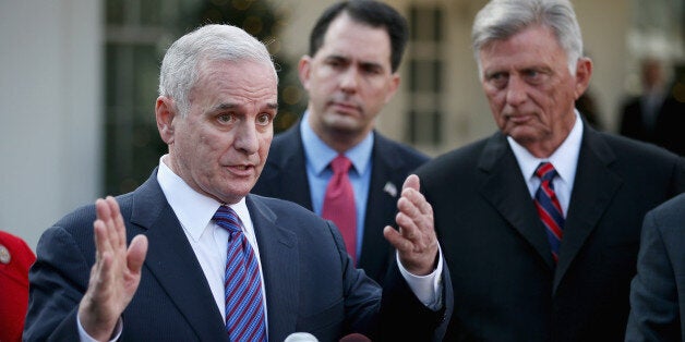 WASHINGTON, DC - DECEMBER 04: U.S. Governors Association Executive Committee members (L-R) Minnesota Gov. Mark Dayton, Wisconsin Gov. Scott Walker and Arkansas Gov. Mike Beebe talk to reporters after meeting with President Barack Obama at the White House December 4, 2012 in Washington, DC. The bipartisan group of governors met with the president to discuss the 'fiscal cliff' and are now headed to Capitol Hill to meet with Speaker of the House John Boehner (R-OH). (Photo by Chip Somodevilla/Getty Images)