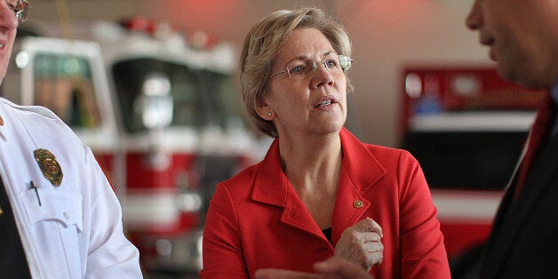 NORTHAMPTON, MA - FEBRUARY 19: U.S. Senator Elizabeth Warren visited a fire station in Northampton, Mass. Warren spoke to Fire Chief Brian P. Duggan, left, and the Northampton Mayor David Narkewicz. (Photo by Suzanne Kreiter/The Boston Globe via Getty Images)