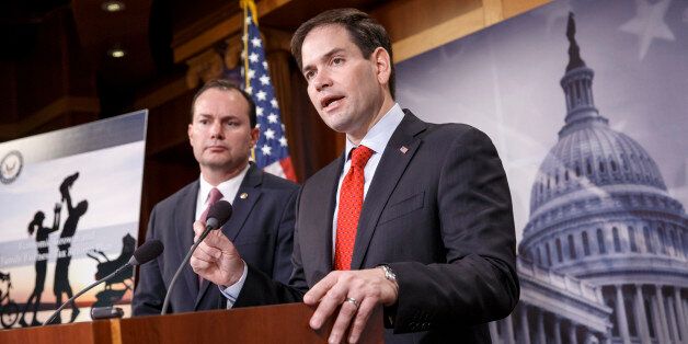 Sen. Marco Rubio, R-Fla., right, accompanied by Sen. Mike Lee, R-Utah, outline their ideas for a new tax plan during a news conference on Capitol Hill in Washington, Wednesday, March 4, 2015. (AP Photo/J. Scott Applewhite)