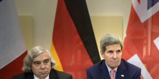 US Secretary of Energy, Ernest Moniz, left, and US Secretary of State, John Kerry wait for the start of a trilateral meeting at an hotel in Lausanne Saturday, March 28, 2015. Negotiations over Iran's nuclear program picked up pace on Saturday with the French and German foreign ministers joining U.S. Secretary of State John Kerry in talks with Tehran's top diplomat ahead of an end-of-March deadline for a preliminary deal. (AP Photo/Brendan Smialowski, Pool)