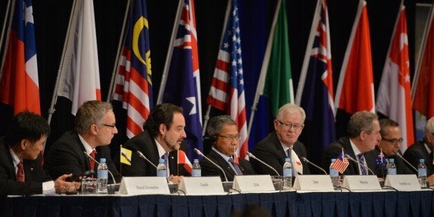 Trade representatives attend at a press conference for the Trans-Pacific Partnership (TPP), a pan-Pacific trade agreement by