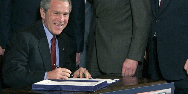 President Bush smiles as he starts to sign the USA Patriot Terrorism Prevention Reauthorization Act in the East Room of the White House Thursday, March 9, 2006, in Washington. A day before parts of the Patriot Act were to expire, Bush signed into law a renewal that will allow the government to keep using terror-fighting tools passed after the Sept. 11, 2001, attacks. Left to right behind Bush are Rep. James Sensenbrenner, R-Wis.; Sen. Arlen Specter, R-Pa., House Speaker Dennis Hastert , R-Ill. (AP Photo/Ron Edmonds)