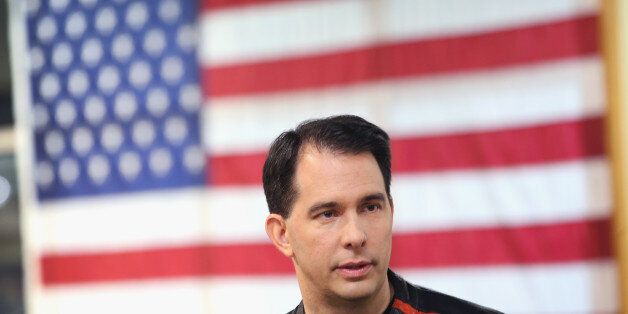 DES MOINES, IA - JUNE 06: Wisconsin Governor Scott Walker gets ready to participate in a Roast and Ride event hosted by freshman Sen. Joni Ernst (R-IA) on June 5, 2015 near Des Moines, Iowa. Ernst is hoping the event, which featured a motorcycle tour, a pig roast, and speeches from several 2016 presidential hopefuls, becomes an Iowa Republican tradition. (Photo by Scott Olson/Getty Images)