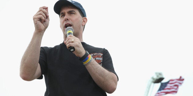 BOONE, IA - JUNE 06: Republican presidential hopeful Wisconsin Governor Scott Walker speaks at a Roast and Ride event hosted by freshman Senator Joni Ernst (R-IA) on June 6, 2015 in Boone, Iowa. Ernst is hoping the event, which featured a motorcycle tour, a pig roast, and speeches from several 2016 presidential hopefuls, becomes an Iowa Republican tradition. (Photo by Scott Olson/Getty Images)