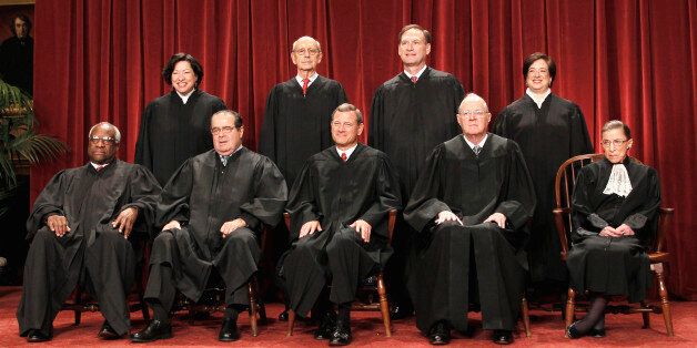 FILE -In this Oct. 8, 2010 file photo justices of the U.S. Supreme Court gather for a group portrait at the Supreme Court in Washington. Seated from left are Associate Justices Clarence Thomas, and Antonin Scalia, Chief Justice John Roberts, Associate Justices Anthony M. Kennedy, and Ruth Bader Ginsburg. Standing, from left are Associate Justices Sonia Sotomayor, Stephen Breyer, Samuel Alito Jr., and Elena Kagan. The nine justices of the Supreme Court, who serve without seeking election, soon will have to decide whether to insert themselves into the center of the nationâs presidential campaign next year. The high court begins its new term Monday, Oct. 3, 2011, and President Barack Obamaâs health care overhaul, which affects almost every American, is squarely in its sights. (AP Photo/Pablo Martinez Monsivais, File)