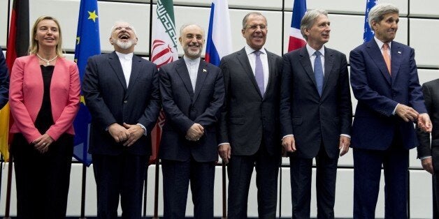 (From L to R) European Union High Representative for Foreign Affairs and Security Policy Federica Mogherini, Iranian Foreign Minister Mohammad Javad Zarif, Head of the Iranian Atomic Energy Organization Ali Akbar Salehi, Russian Foreign Minister Sergey Lavrov, British Foreign Secretary Philip Hammond and US Secretary of State John Kerry pose for a group picture at the United Nations building in Vienna, Austria July 14, 2015. Iran and six major world powers reached a nuclear deal, capping more than a decade of on-off negotiations with an agreement that could potentially transform the Middle East, and which Israel called an 'historic surrender'. AFP PHOTO / POOL / JOE KLAMAR (Photo credit should read JOE KLAMAR/AFP/Getty Images)