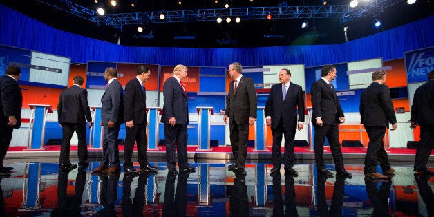 Republican presidential candidates from left, New Jersey Gov. Chris Christie, Sen. Marco Rubio, R-Fla., Ben Carson, Wisconsin Gov. Scott Walker, Donald Trump, former Florida Gov. Jeb Bush, former Arkansas Gov. Mike Huckabee, Sen. Ted Cruz, R-Texas, Sen. Rand Paul, R-Ky., and Ohio Gov. John Kasich take the stage for the first Republican presidential debate at the Quicken Loans Arena, Thursday, Aug. 6, 2015, in Cleveland. (AP Photo/Andrew Harnik)