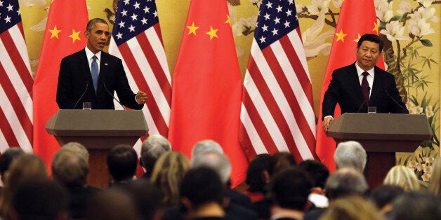 U.S. President Barack Obama, left, speaks next to Chinese President Xi Jinping during their joint press conference at the Gre