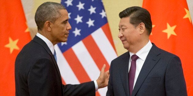 U.S. President Barack Obama, left, and Chinese President Xi Jinping shake hands following the conclusion of their joint news conference at the Great Hall of the People in Beijing, Wednesday, Nov. 12, 2014. (AP Photo/Pablo Martinez Monsivais)