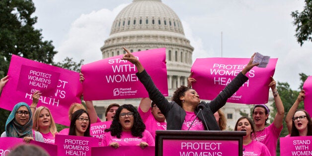 Cheered on by Carol McDonald from Planned Parenthood Federation of America, women rally on Capitol Hill in Washington, Thursday, July 11, 2013, to oppose legislation that would limit legal abortion. (AP Photo/J. Scott Applewhite)