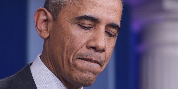 US President Barack Obama pauses as he delivers a statement, after a shooting at a community college in Oregon that left up to 10 people dead, in the Brady Briefing Room of the White House in Washington, DC on October 1, 2015. A 20-year-old gunman opened fire inside a classroom at Umpqua Community College in rural Roseburg, before being 'neutralized' by police, authorities said. He was later confirmed dead. AFP PHOTO/MANDEL NGAN (Photo credit should read MANDEL NGAN/AFP/Getty Images)