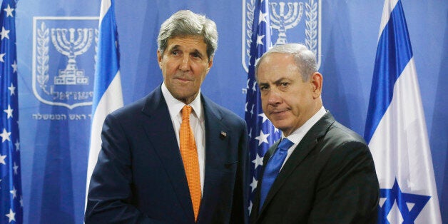 U.S. Secretary of State John Kerry, left, meets with Israeli Prime Minister Benjamin Netanyahu in Tel Aviv, Israel, Wednesday, July 23, 2014. Kerry flew into Tel Aviv despite a Federal Aviation Administration ban following a Hamas rocket that hit near the airport the day before, reflecting his determination to achieve a cease-fire agreement between the warring sides. (AP Photo/Pool)