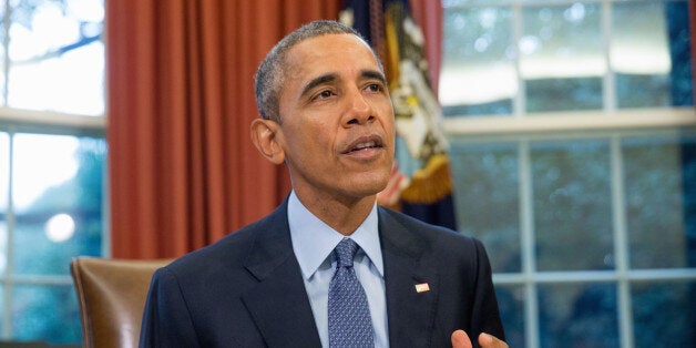 President Barack Obama speaks to members of the media before signing H.R. 1314, the "Bipartisan Budget Act of 2015," Monday, Nov. 2, 2015, in the Oval Office in the White House in Washington, Monday, Nov. 2, 2015, before traveling Andrews Air Force Base, Md., on his way to Newark, N.J. Obama will spend the day highlighting the re-entry process of formerly incarcerated individuals back into society. (AP Photo/Andrew Harnik)