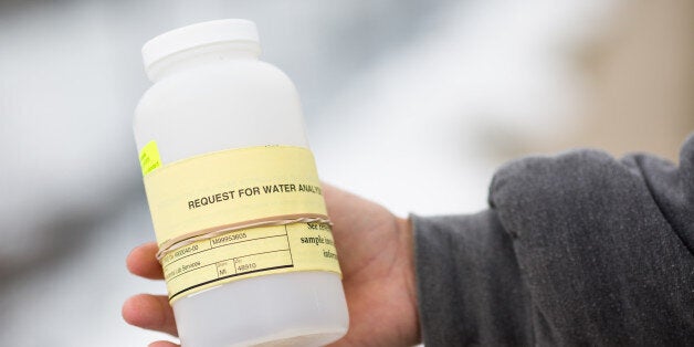 FLINT, MI - JANUARY 23: A water collection device is handed out to citizens of Flint for testing contaminated water on January 23, 2016 in Flint, Michigan. A federal state of emergency has been declared due to the city's water supply being contaminated. (Photo by Brett Carlsen/Getty Images)