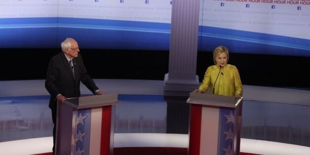 US Democratic presidential candidates Hillary Clinton and Bernie Sanders participate in the PBS NewsHour Presidential Primary Debatein Milwaukee, Wisconsin on February 11, 2016. / AFP / Tasos Katopodis (Photo credit should read TASOS KATOPODIS/AFP/Getty Images)