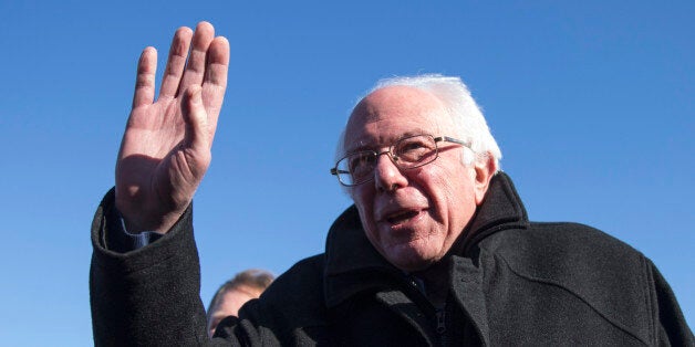 Democratic presidential candidate, Sen. Bernie Sanders, I-Vt. gestures as he speaks with media, Friday, Feb. 12, 2016, upon h