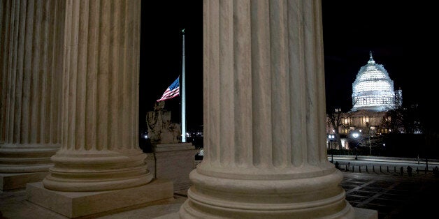 WASHINGTON, DC - FEBRUARY 13: The American flag flies at half mast at the U.S. Supreme Court February 13, 2016 in Washington, DC. Supreme Court Justice Antonin Scalia was at a Texas Ranch Saturday morning when he died at the age of 79. (Photo by Drew Angerer/Getty Images)