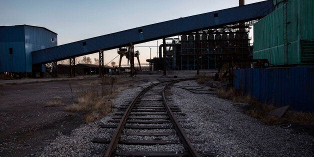 TANGSHAN, CHINA - JANUARY 26: A railway track is seen in the abandoned Qingquan Steel plant which closed in 2014 and became one of several so-called 'zombie factories', on January 26, 2016 in Tangshan, China. China's government plans to slash steel production by up to 150 million tons, which could see the loss of as many as 400,000 jobs according to state estimates. Officials point to excessive industrial capacity, a slump in demand and plunging prices as they attempt to restructure China's slowing economy. Hebei province, long regarded as China's steel belt, once accounted for nearly a quarter of the country's steel output. In recent years, state-owned steel mills have been shut down and dozens of small privately-owned plants in the area have gone bankrupt. (Photo by Kevin Frayer/Getty Images)