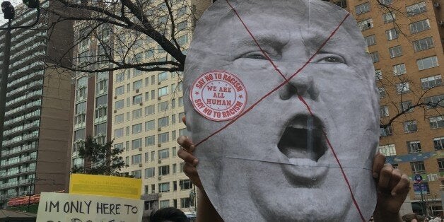 NEW YORK, NY - MARCH 19: New Yorkers gathered at Columbus Circle for a rally and march to Trump Tower to protest against Rep