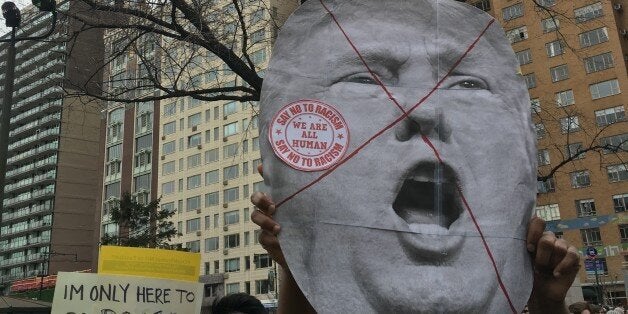 NEW YORK, NY - MARCH 19: New Yorkers gathered at Columbus Circle for a rally and march to Trump Tower to protest against Republican Presidential Candidate Donald Trump on March 19. (Photo by Selcuk Acar/Anadolu Agency/Getty Images)