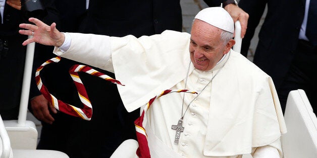 Scarves are thrown to Pope Francis at the end of a mass for the Youth Jubilee in Saint Peter's Square at the Vatican, April 24, 2016. REUTERS/Tony Gentile