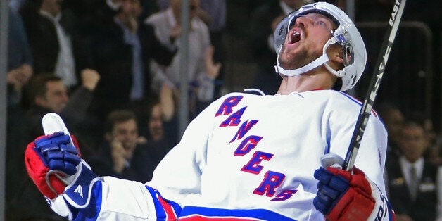 NEW YORK, NY - DECEMBER 08: Kevin Klein #8 of the New York Rangers celebrates his game winning goal at 3:45 of overtime against the Pittsburgh Penguins at Madison Square Garden on December 8, 2014 in New York City. The Rangers defeated the Penguins 4-3 in overtime. (Photo by Bruce Bennett/Getty Images)