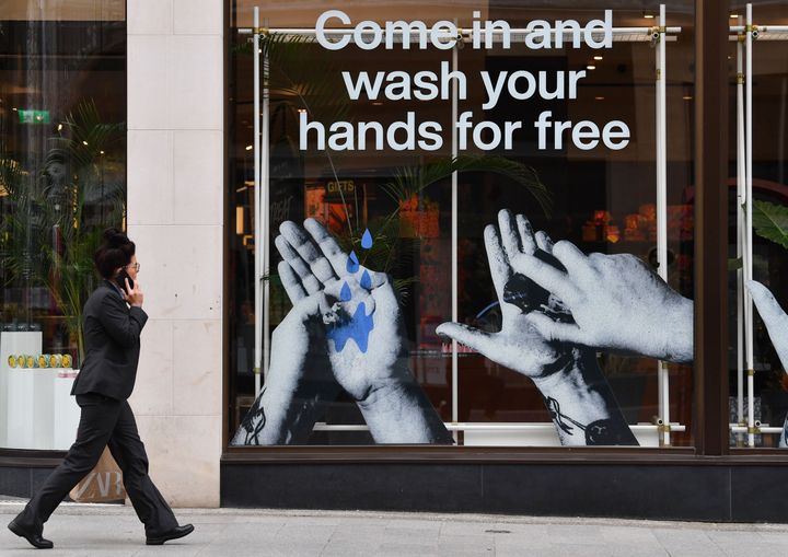 A cosmetics shop in Liverpool, northwest England, advertises free handwashing facilities inside. Health officials recommend f