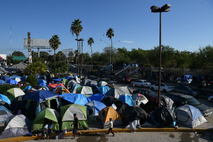 Migrants, most of them asylum-seekers sent back to Mexico from the U.S. under the Trump administration's "Remain in Mexico" program, occupy a makeshift encampment in Matamoros, Mexico, on Oct. 28, 2019.