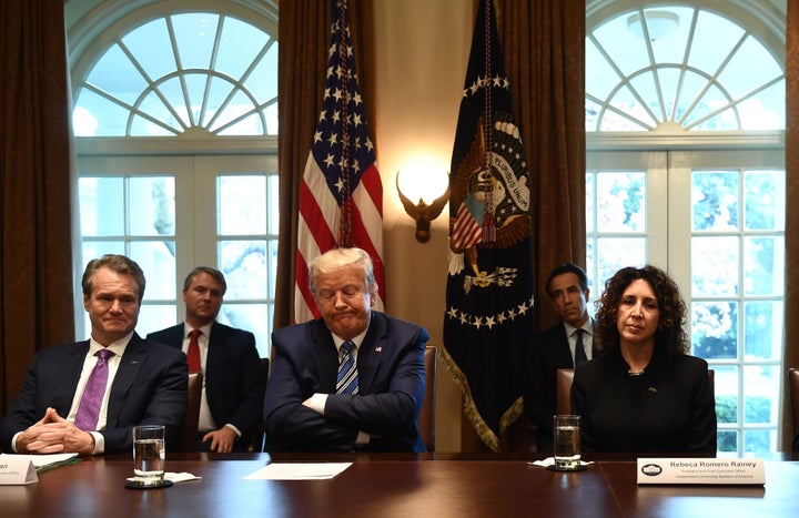 President Donald Trump reacts during a White House meeting with banking leaders to discuss how the financial services industry can meet the needs of customers affected by COVID-19 on March 11, 2020.