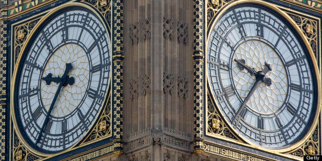 Clock faces sit in the Big Ben clock tower at the Houses of Parliament in London, U.K., on Monday, July 15, 2013. Britain's economy will grow faster this year than previously forecast as consumers cut into savings to keep spending, according to the Ernst & Young Item Club. Photographer: Jason Alden/Bloomberg via Getty Images