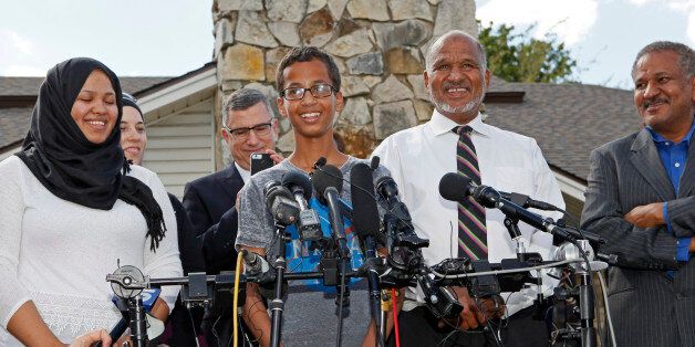 IRVING, TX - SEPTEMBER 16: 14-year-old Ahmed Ahmed Mohamed, surrounded by his family, speaks during a news conference on September 16, 2015 in Irving, Texas. Mohammed was detained after a high school teacher falsely concluded that a homemade clock he brought to class might be a bomb. The news converence, held outside the Mohammed family home, was hosted by the North Texas Chapter of the Council on American-Islamic Relations. (Photo by Ben Torres/Getty Images)