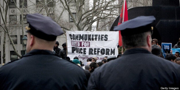 NEW YORK, NY - MARCH 18: New York CIty Police officers watch over a demonstration against the city's 'stop and frisk' searches in lower Manhattan near Federal Court March 18, 2013 in New York City. Hearings in a federal lawsuit filed by four black men against the city police department's 'stop and frisk' searches starts today in Manhattan Federal Court. (Photo by Allison Joyce/Getty Images)