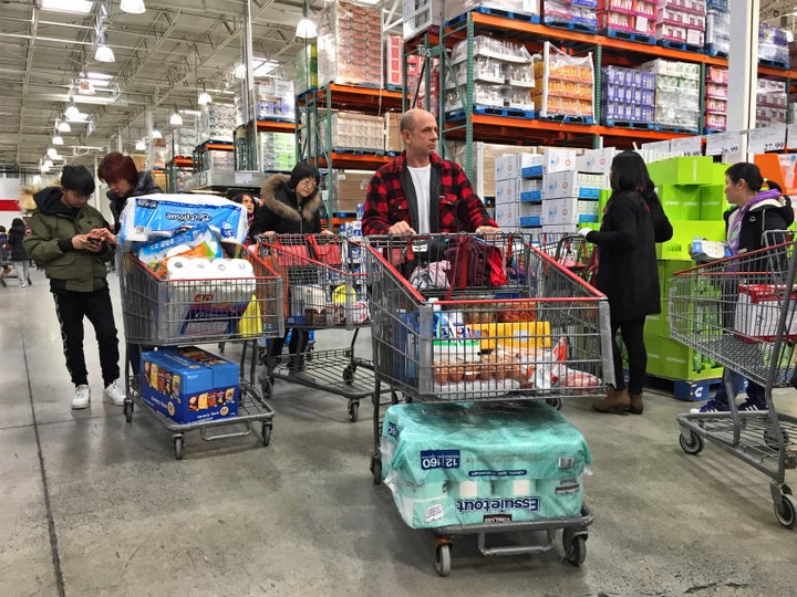 Canadians, including shoppers seen here in Markham, Ont., are stocking up on essential items during the COVID-19 outbreak.