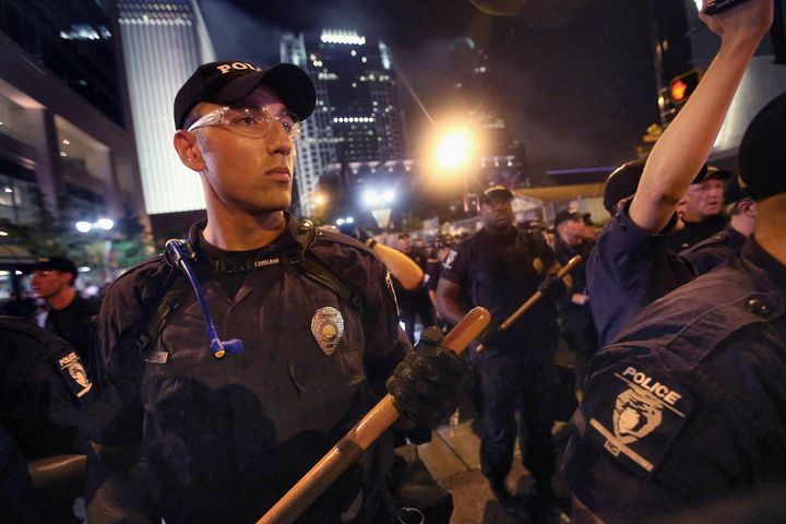 CHARLOTTE, NC - SEPTEMBER 04: Police face off with protesters during a march on the Democratic National Convention September 4, 2012 in Charlotte, North Carolina. Police officers from around the country are in Charlotte to provide security for the Democratic National Convention which begins today and runs through Thursday. (Photo by Scott Olson/Getty Images)
