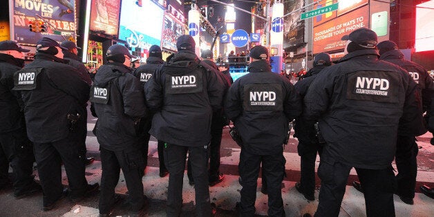 NEW YORK, NY - DECEMBER 31: Members of the New York City Police Department attend New Year's Eve 2013 With Carson Daly in Times Square on December 31, 2013 in New York City. (Photo by Brad Barket/Getty Images)