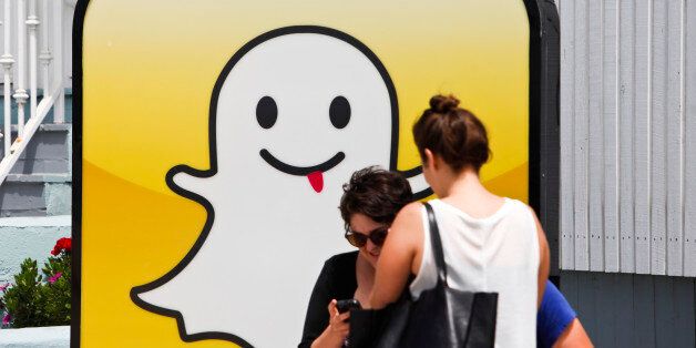 People take pictures in front of the Snapchat Inc. headquarters on the strand at Venice Beach in Los Angeles, California, U.S., on Wednesday, Aug. 14, 2013. Snapchat is a photo and video sharing application that allows the user to pre-set a period of time, no more than ten seconds, for the receiver to view the content before it disappears from the screen. Photographer: Patrick Fallon/Bloomberg via Getty Images