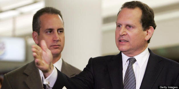 Miami, UNITED STATES: Cuban-American member of the US House of Representatives Lincoln Diaz-Balart (R) speaks during a press conference at Miami's International Airport after he, his brother Rep. Mario Diaz-Balart (L), and Rep. Ileana Ros-Lehtinen (not pictured) returned from Washington, DC, 02 August, 2006, where they discussed the possible changes occuring in Cuba with members of Bush's National Security Council. AFP PHOTO/Roberto SCHMIDT (Photo credit should read ROBERTO SCHMIDT/AFP/Getty Images)